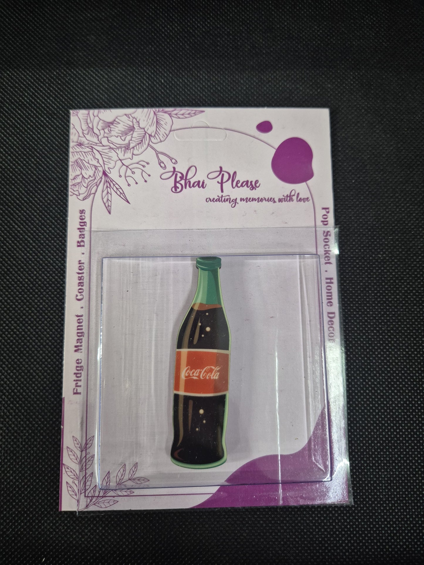 A magnetic Coke bottle with an iconic design.