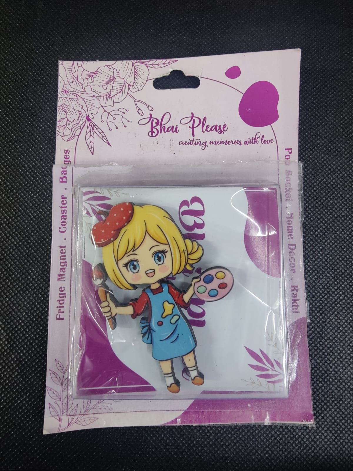 Fridge magnet depicting an artist at work