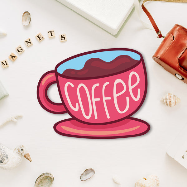 A miniature, charming coffee cup-shaped fridge magnet with steam coming from it.