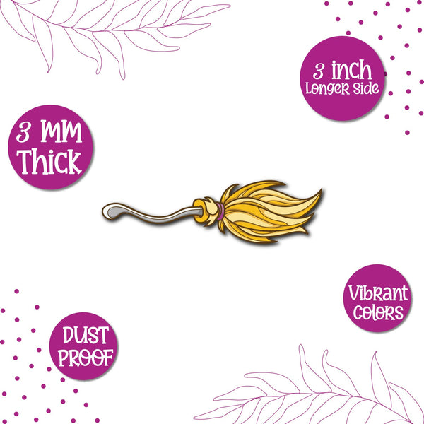 A Harry Potter broomstick on a fridge magnet.