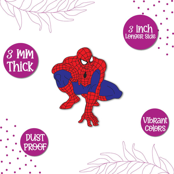 A Spiderman superhero figure in a classic pose, on a fridge magnet.