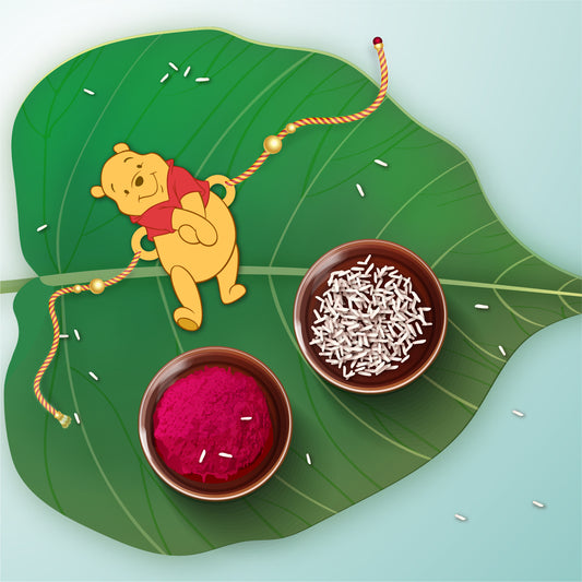 Charming Winnie Pooh Wooden Rakhi with Rudraksha thread worn on a brother's wrist