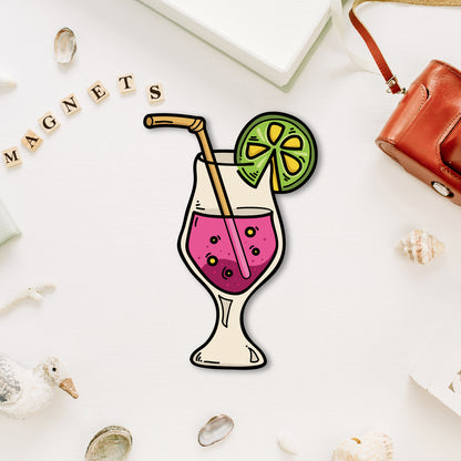 A vibrant, miniature cocktail glass-shaped fridge magnet with a straw and garnish.