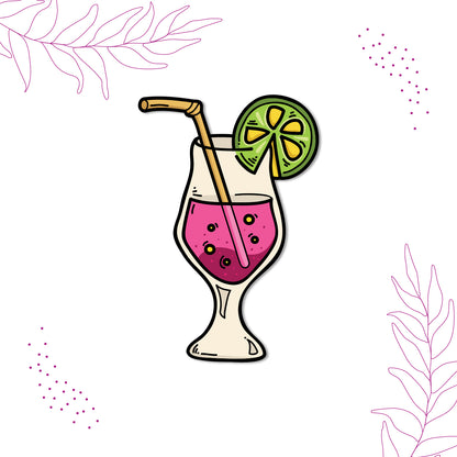 Close-up of a colorful cocktail magnet on a refrigerator.