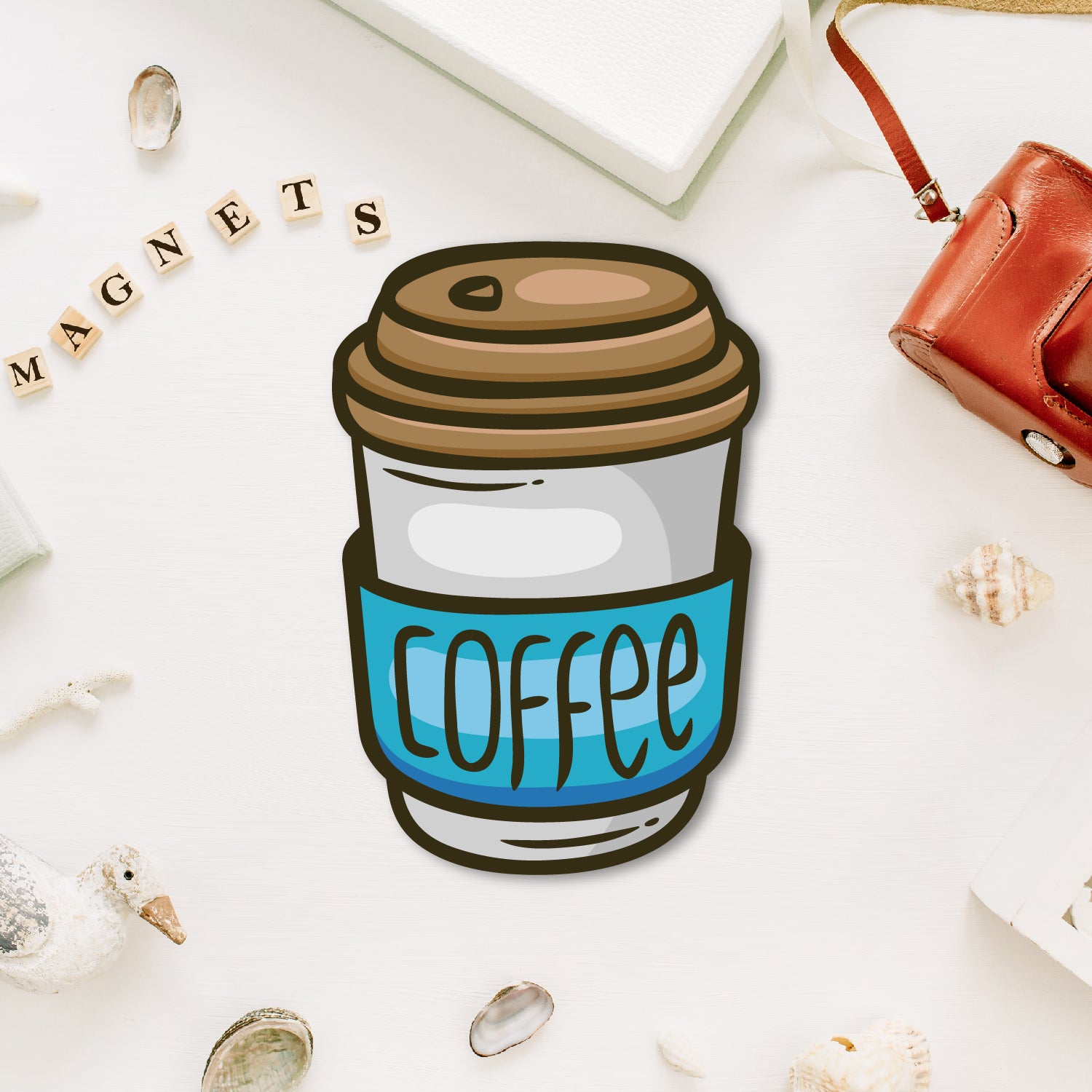 A miniature, retro-style blue coffee can-shaped fridge magnet with a vintage label.