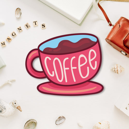 A miniature, charming coffee cup-shaped fridge magnet with steam coming from it.