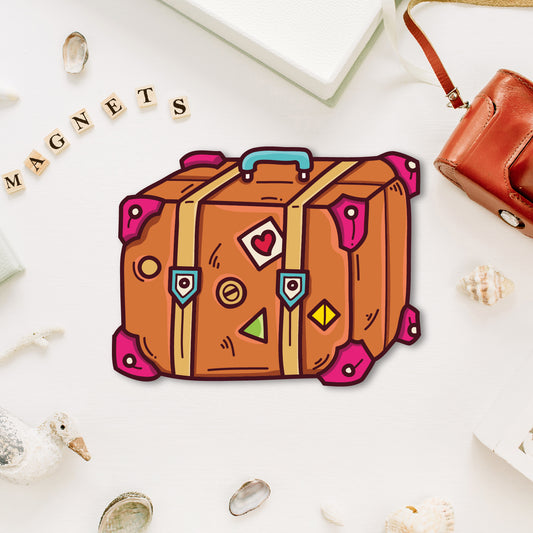 Travel luggage fridge magnet with vintage stickers.