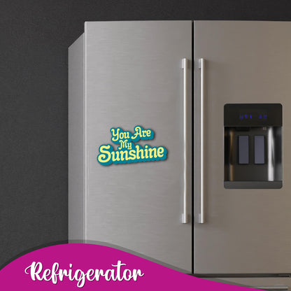 Close-up of the "You Are My Sunshine" text on a magnet.