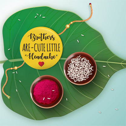 Close-up detail of 'Brothers are Cute Little Headache' inscription on metal Rakhi and magnet.