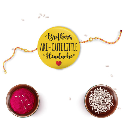 Brother smiling wryly, holding his new 'Cute Little Headache' Metal Rakhi.