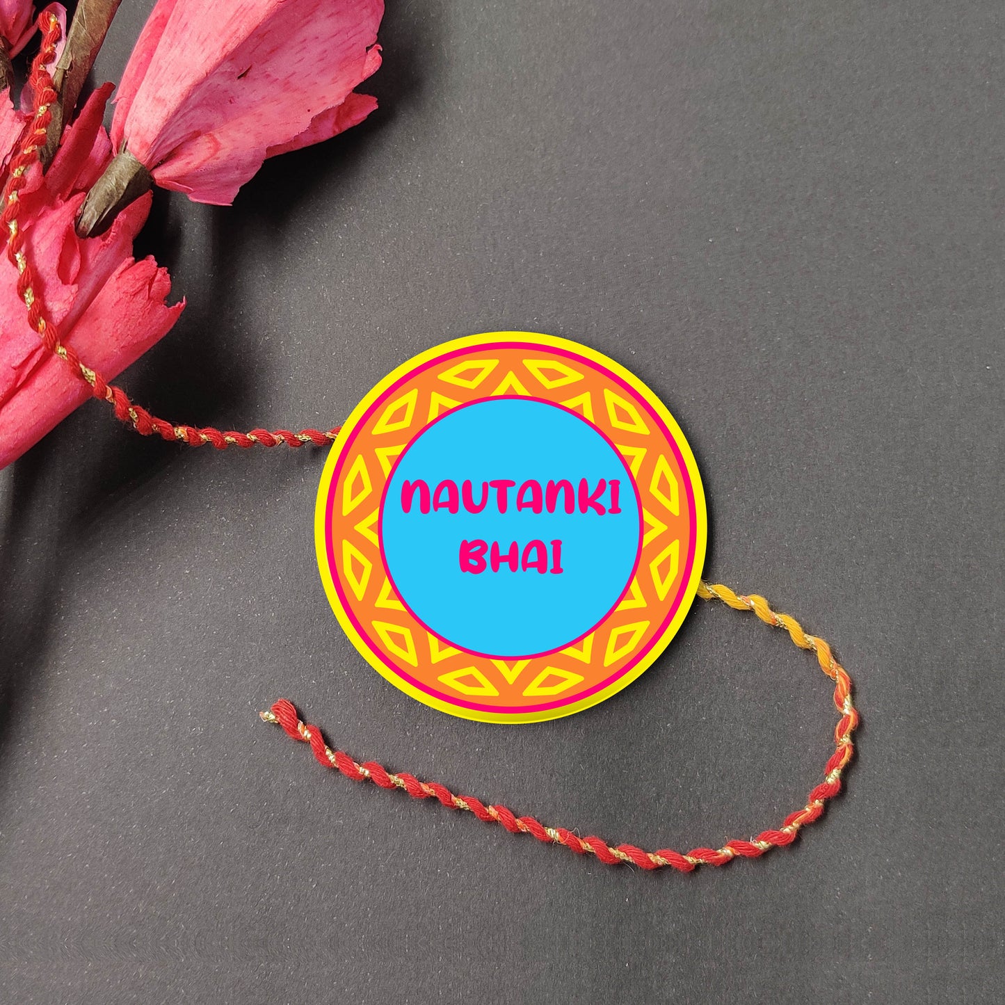 Nautanki Bhai Metal Rakhi on a thread, with Roli and Chawal for Raksha Bandhan.