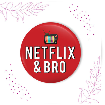 Netflix & Bro metal magnet stuck to a refrigerator door, perhaps near a snack drawer.