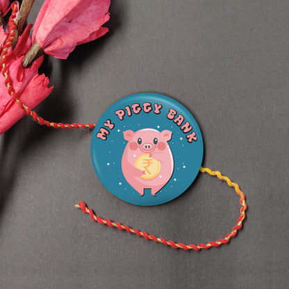 My Piggy Bank Metal Rakhi on a thread, with Roli and Chawal for Raksha Bandhan.