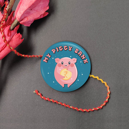 My Piggy Bank Metal Rakhi on a thread, with Roli and Chawal for Raksha Bandhan.