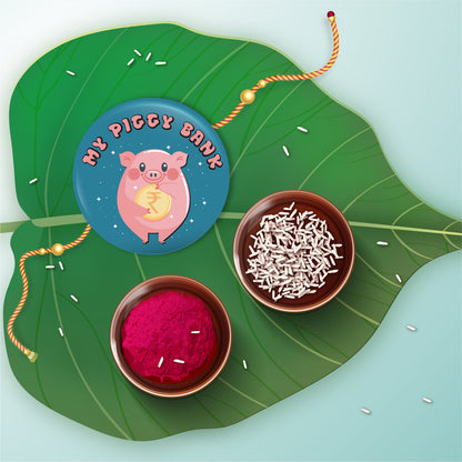 My Piggy Bank Rakhi shown both on a thread and as a fridge magnet.