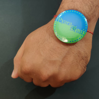 Pyara Bhai Rakhi shown both on a thread and as a fridge magnet.