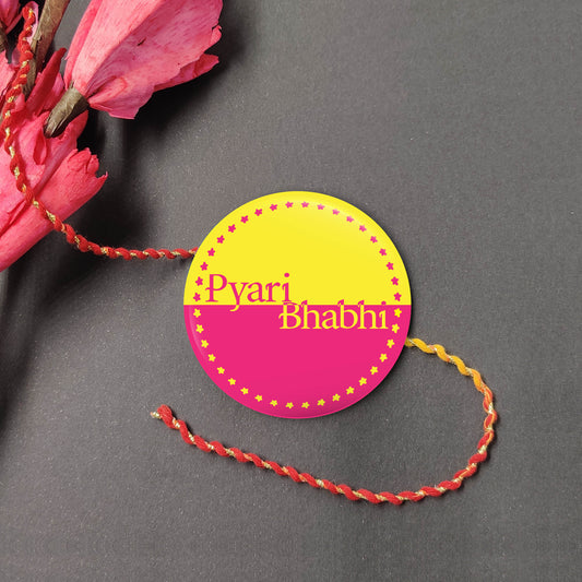 Pyari Bhabhi Metal Lumba on a decorative tassel, with Roli and Chawal for Raksha Bandhan."