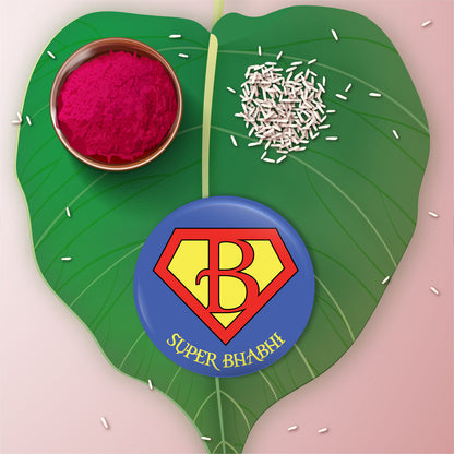 Close-up detail of 'Super Bhabhi' inscription or heroic emblem on metal Rakhi/Lumba and magnet
