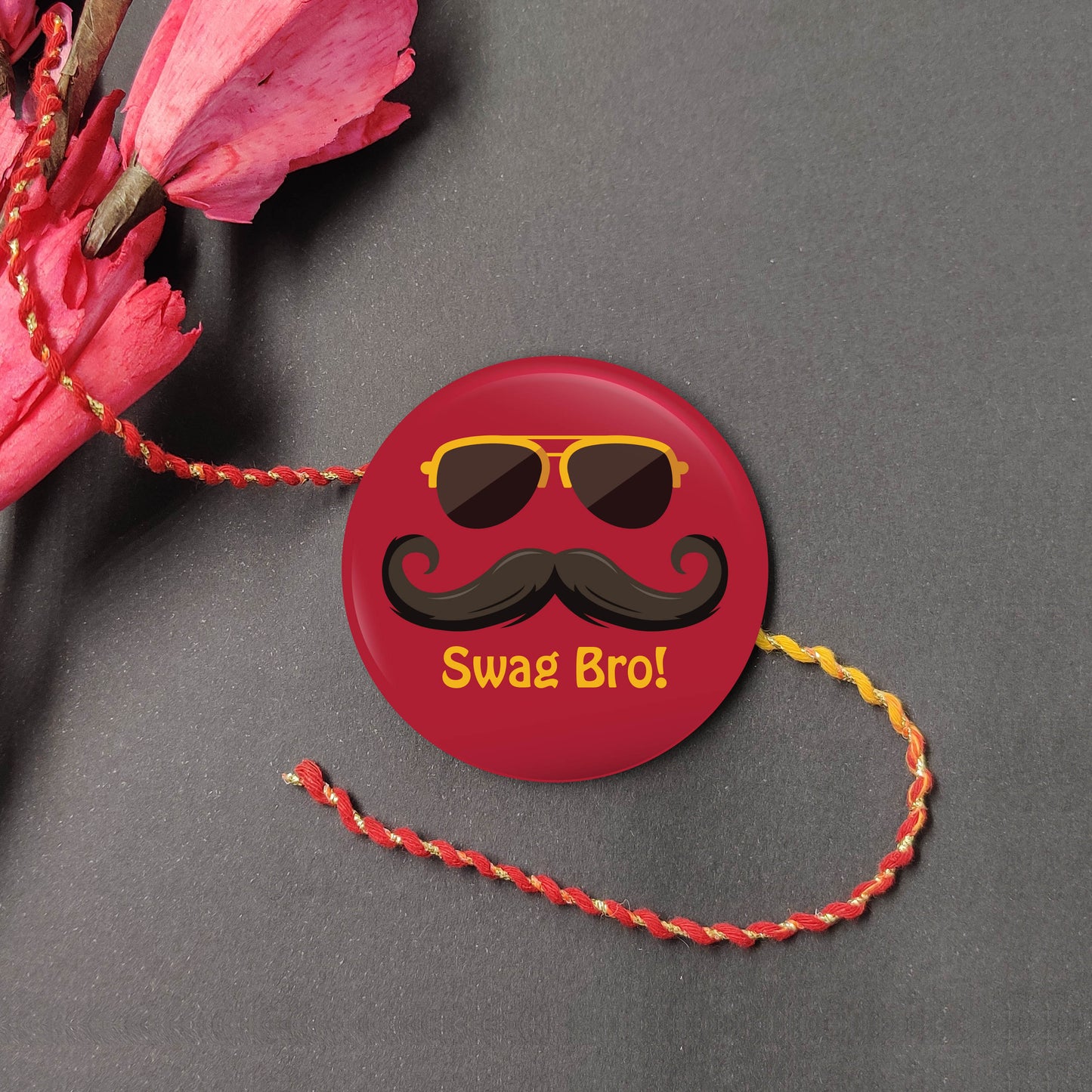 Swag Bro Metal Rakhi on a thread, with Roli and Chawal for Raksha Bandhan.