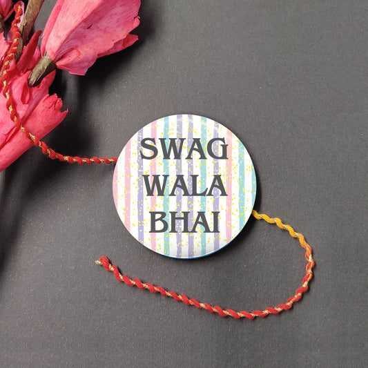 Swag Wala Bhai Metal Rakhi on a thread, presented with Roli and Chawal for Raksha Bandhan.