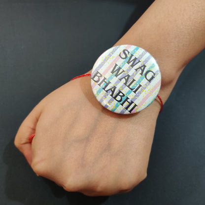 Swag Wali Bhabhi Rakhi/Lumba shown both on its thread/tassel and as a fridge magnet.