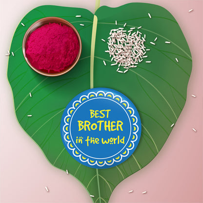 Close-up detail of 'Best Brother in the World' inscription on metal Rakhi and magnet.