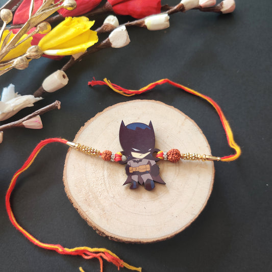 Batman Wooden Rakhi with Rudraksha thread, presented with Roli and Chawal for Raksha Bandhan