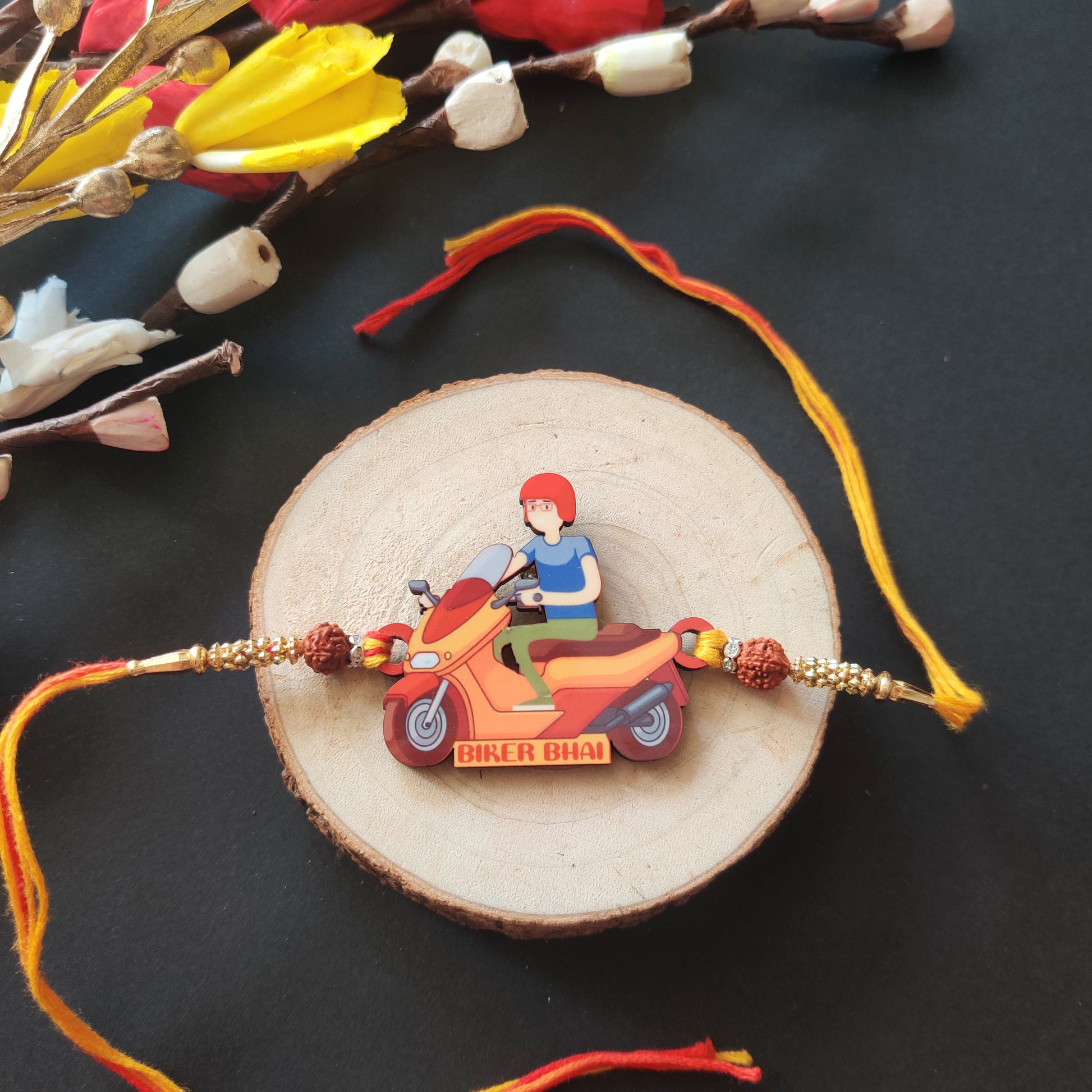 Biker Bhai Wooden Rakhi with Rudraksha thread, presented with Roli and Chawal for Raksha Bandhan.