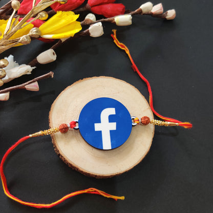 Facebook Wooden Rakhi with Rudraksha thread, presented with Roli and Chawal.