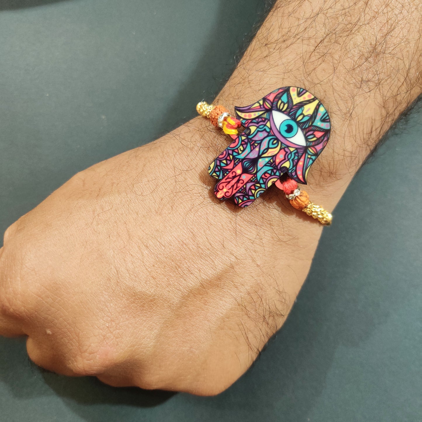 Wooden Rakhi with sacred Rudraksha thread – Hamsa symbol Rakhi