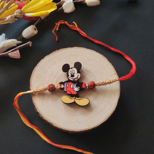 Mickey Wooden Rakhi with Rudraksha thread, presented with Roli and Chawal for Raksha Bandhan.