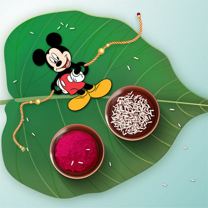 Close-up detail of Mickey Mouse design on wooden Rakhi with Rudraksha beads.