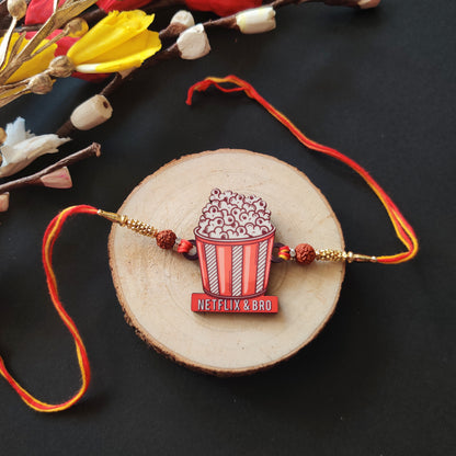 Netflix & Bro Wooden Rakhi with Rudraksha thread, presented with Roli and Chawal.