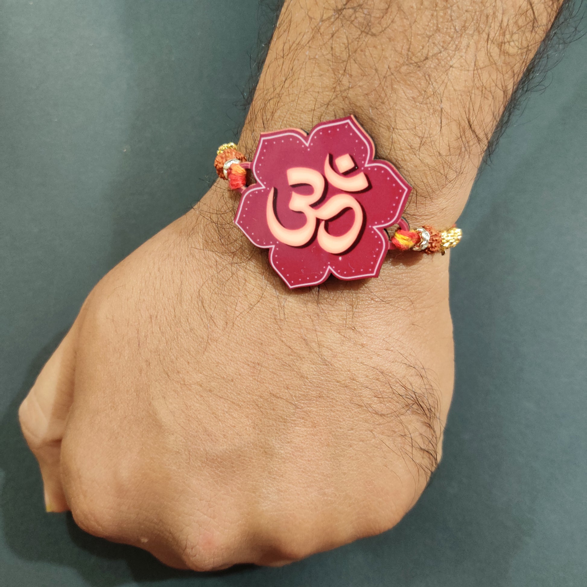 Traditional Rakhi with Om symbol and Rudraksha thread