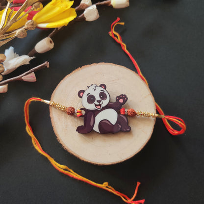 Panda Wooden Rakhi with Rudraksha thread, presented with Roli and Chawal for Raksha Bandhan.
