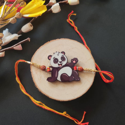 Panda Wooden Rakhi with Rudraksha thread, presented with Roli and Chawal for Raksha Bandhan.