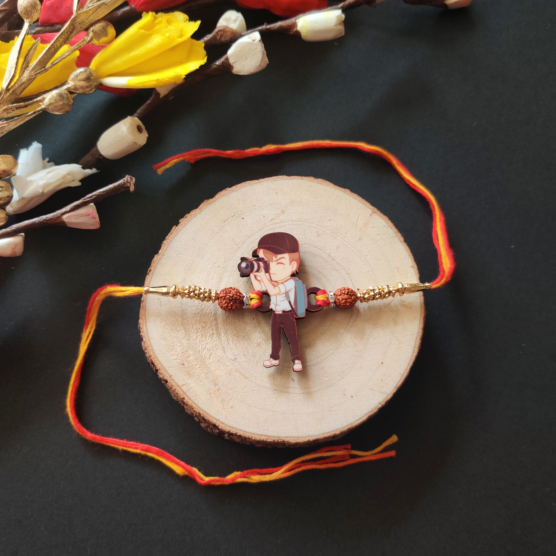 Photographer Bhai Wooden Rakhi with Rudraksha thread, presented with Roli and Chawal.