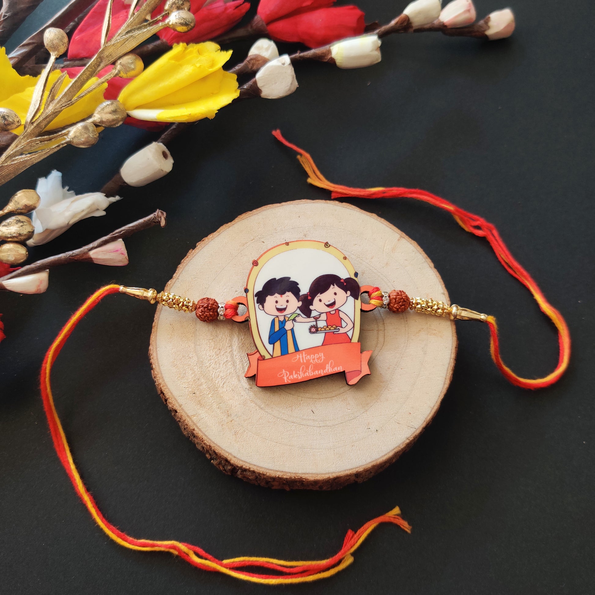 Happy Rakshabandhan Wooden Rakhi with Rudraksha thread, presented with Roli and Chawal.