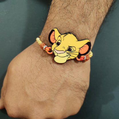Brave Simba Wooden Rakhi with Rudraksha thread worn on a brother's wrist.