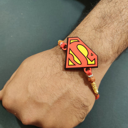 Mighty Superman Wooden Rakhi with Rudraksha thread worn on a brother's wrist